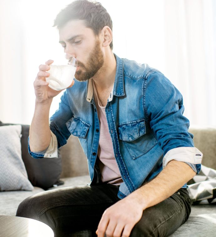 man-drinking-medicines-feeling-bad-at-home-2022-01-19-00-17-34-utc-min